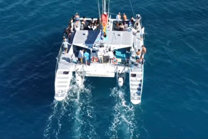 Board from Waikiki Beach for a scenic Sunset Sail on the Hāwea - Boarding at the Duke Paoa Kahanamoku Statue: Simple, But Watch Your Timing