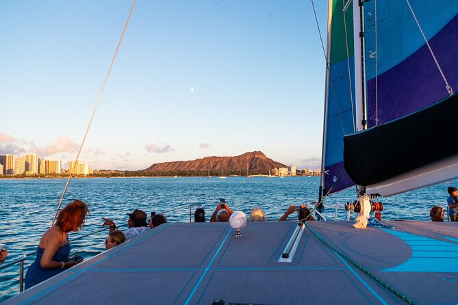 Board from Waikiki Beach for a scenic Sunset Sail on the Hāwea - Music, Crew Energy, and Real Help With Photos