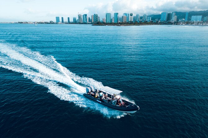Turtle Canyon Snorkel: Semi Private Boat Tour - Waikiki stop: turtles and fish with the city in the background